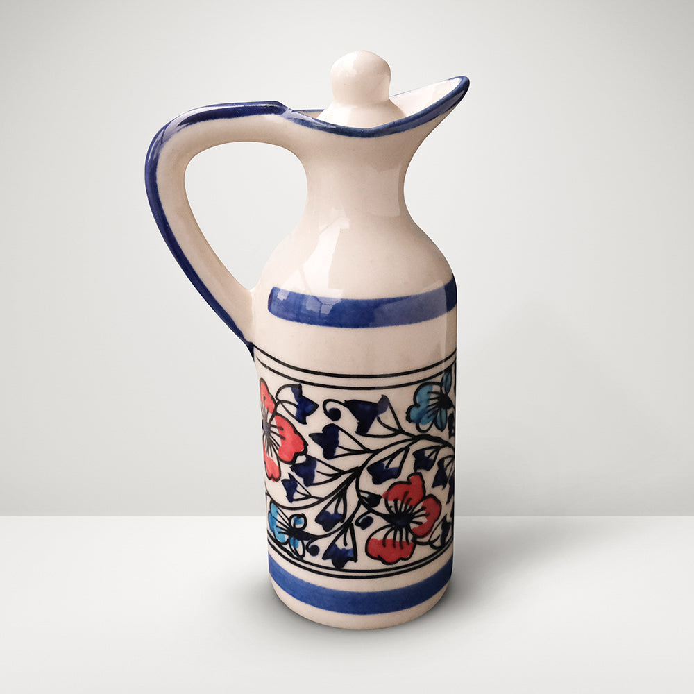 Handmade ceramic small multipurpose bottle with lid on top, blue, red and ivory colors